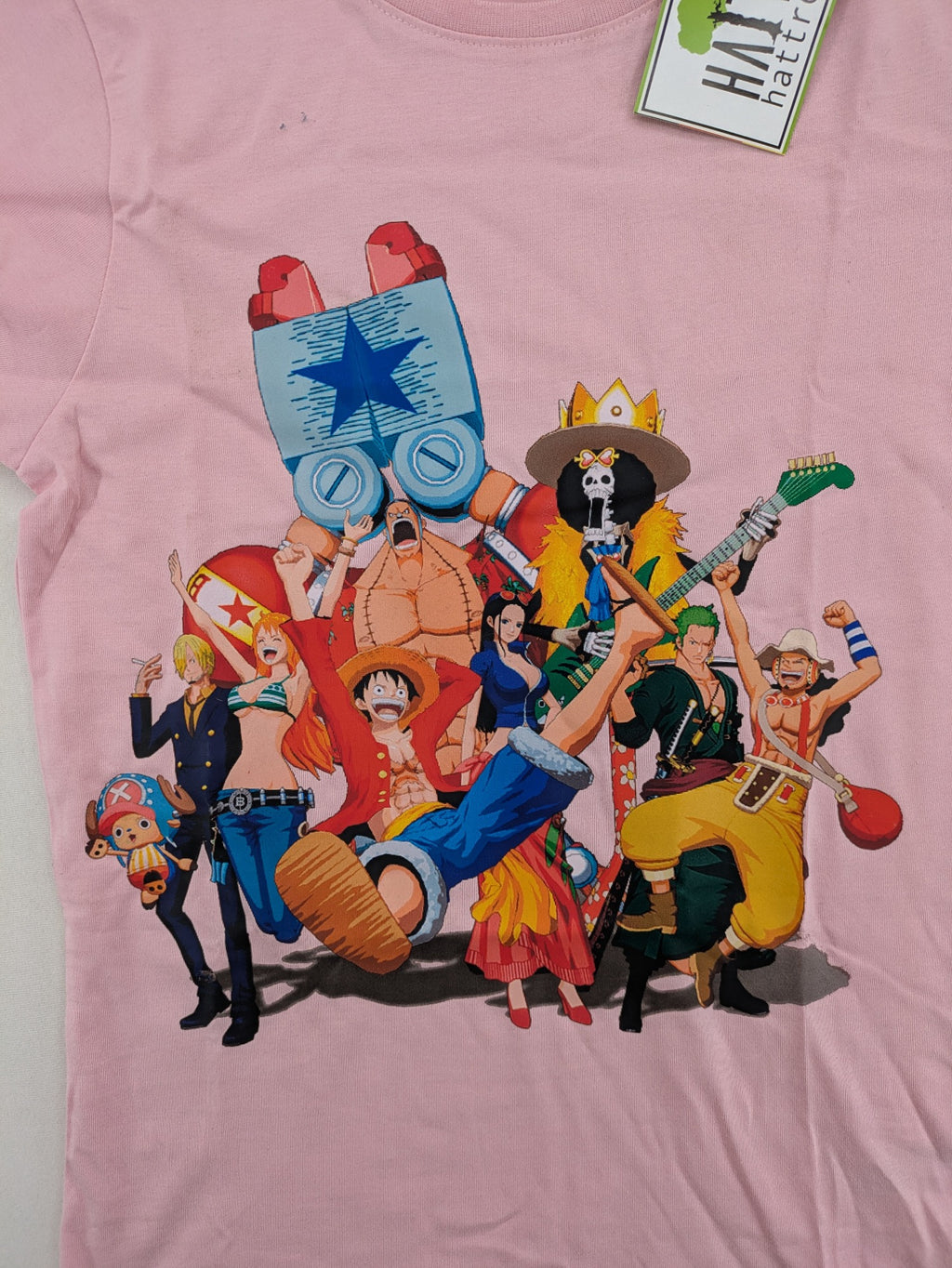 One Piece pink graphic tee featuring colorful Straw Hat crew print and classic fit.