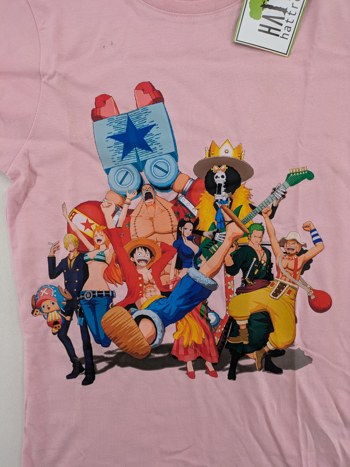 One Piece pink graphic tee featuring colorful Straw Hat crew print and classic fit.