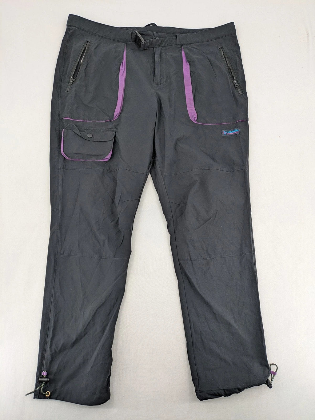 Columbia black trousers with Omni-Shield technology and contrasting purple details.