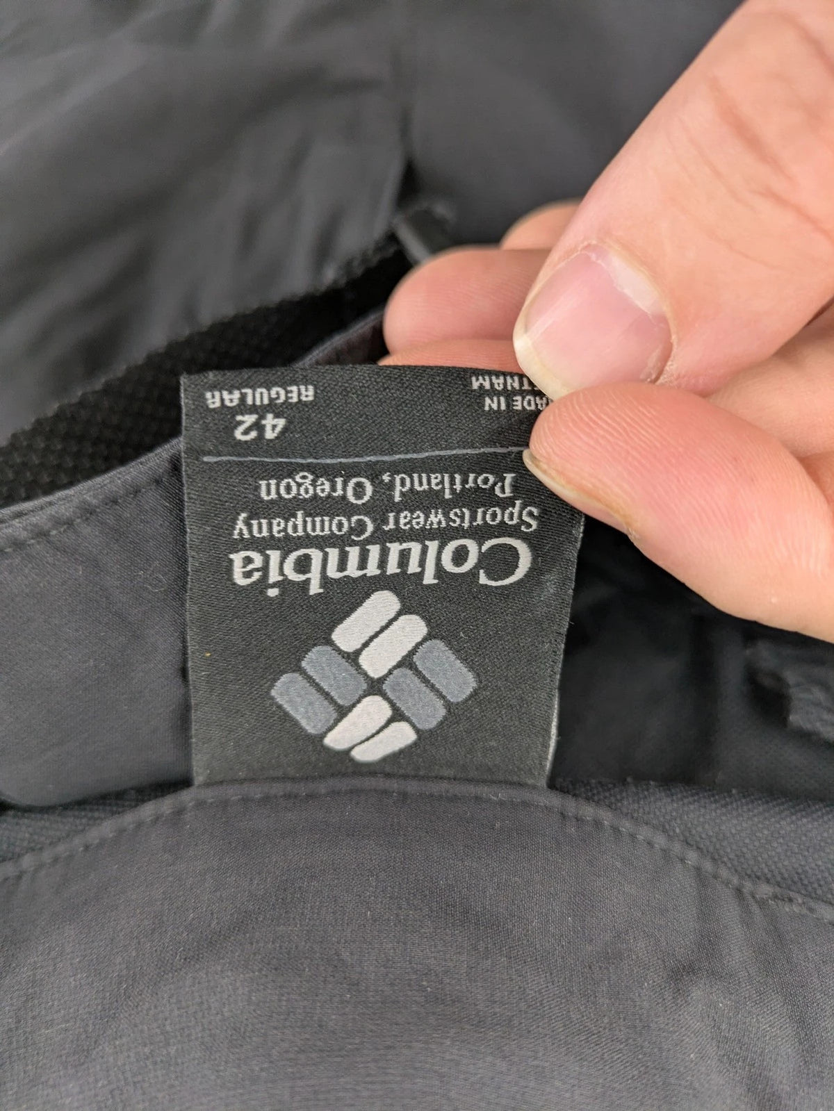Columbia black trousers with Omni-Shield technology and contrasting purple details.