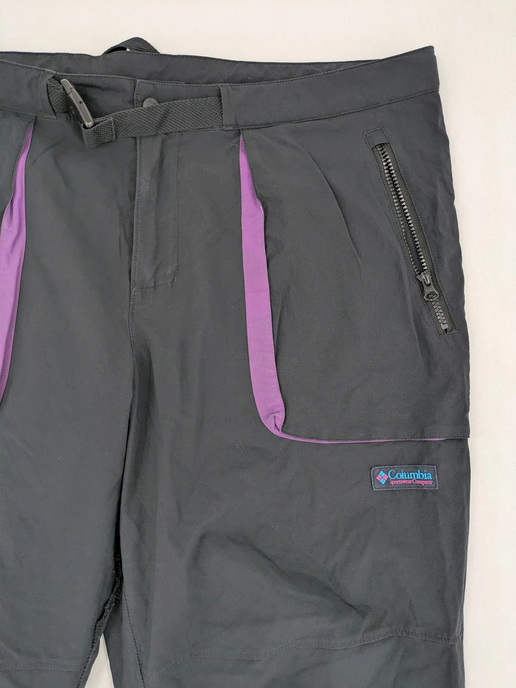 Columbia black trousers with Omni-Shield technology and contrasting purple details.