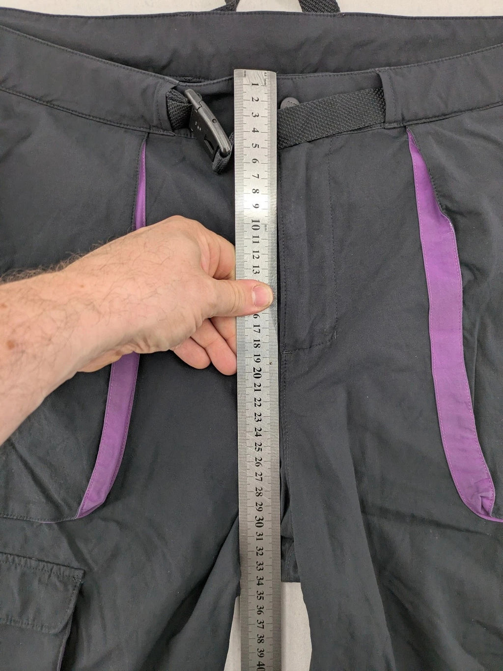 Columbia black trousers with Omni-Shield technology and contrasting purple details.