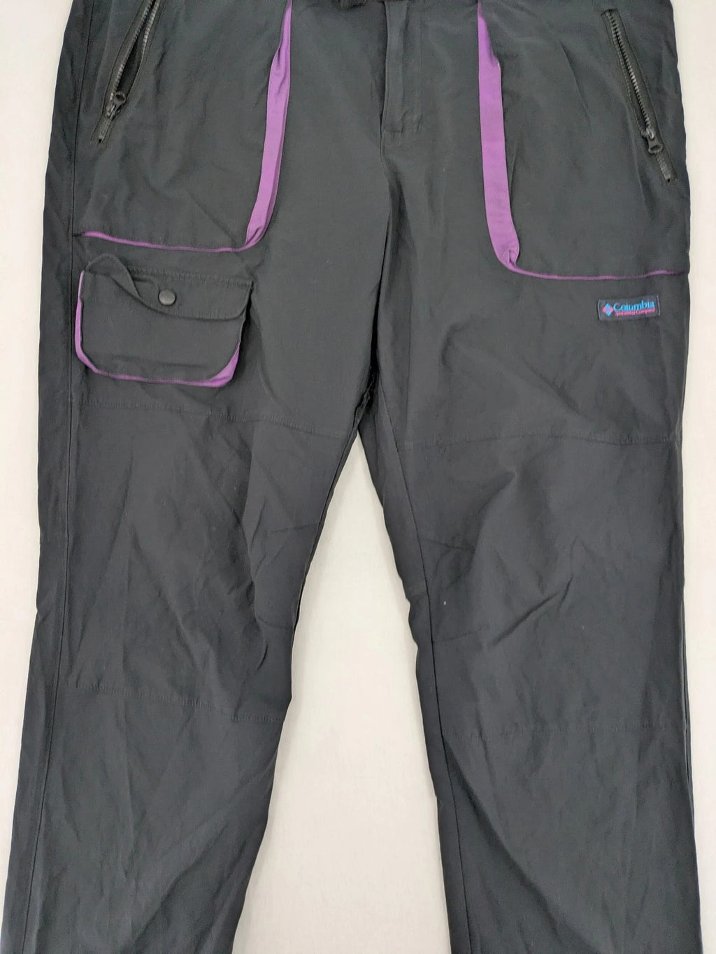 Columbia black trousers with Omni-Shield technology and contrasting purple details.