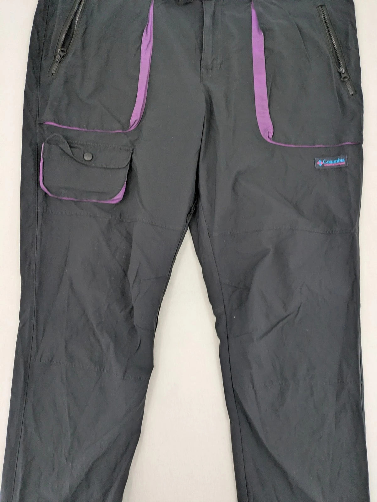 Columbia black trousers with Omni-Shield technology and contrasting purple details.