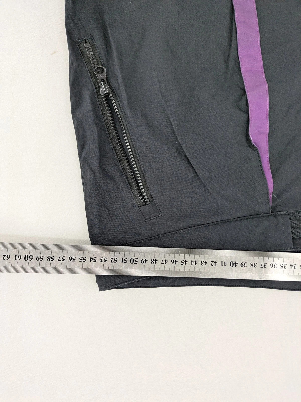 Columbia black trousers with Omni-Shield technology and contrasting purple details.