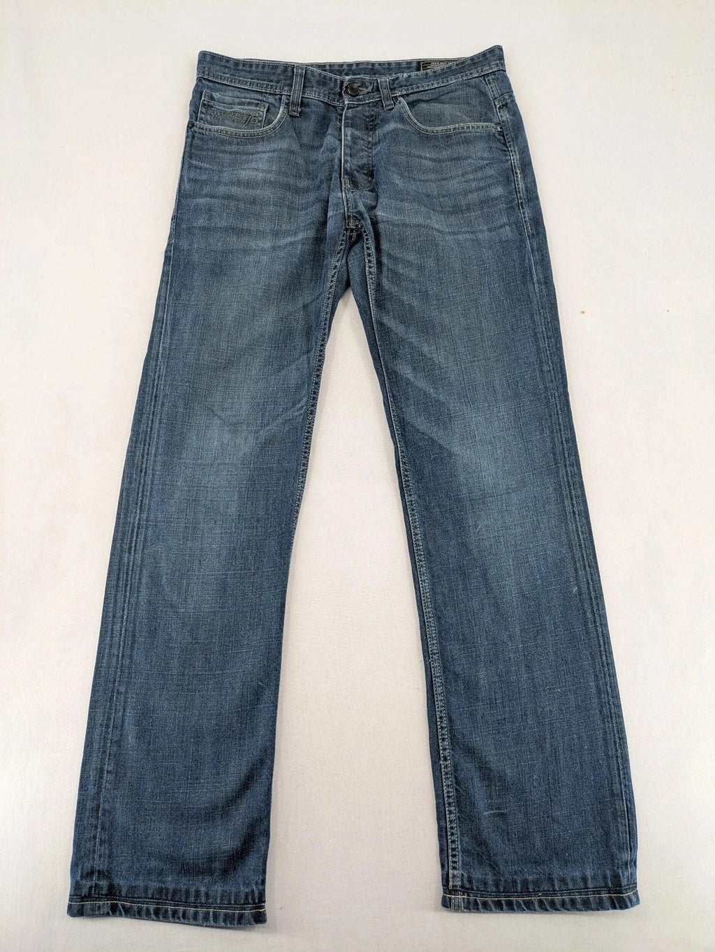 Jack & Jones blue straight jeans with button fly and classic five-pocket design.