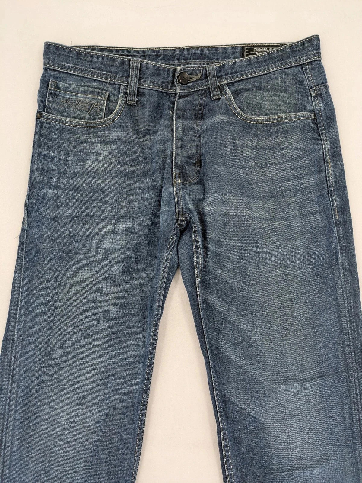 Jack & Jones blue straight jeans with button fly and classic five-pocket design.