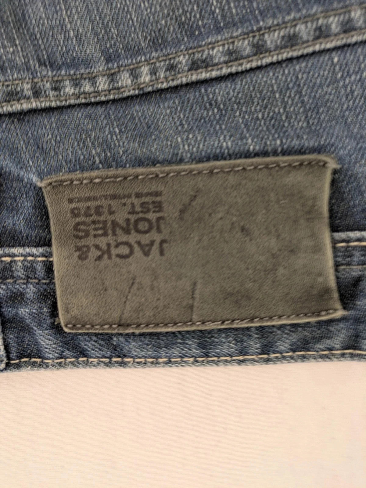 Jack & Jones blue straight jeans with button fly and classic five-pocket design.