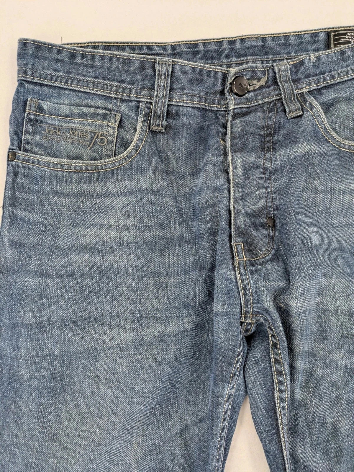 Jack & Jones blue straight jeans with button fly and classic five-pocket design.