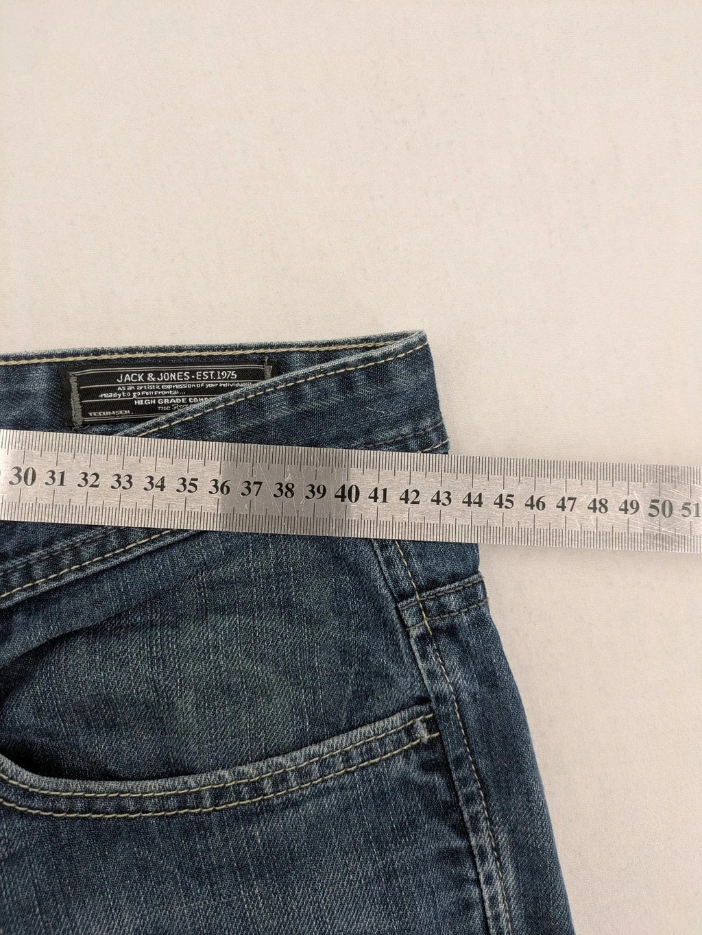 Jack & Jones blue straight jeans with button fly and classic five-pocket design.