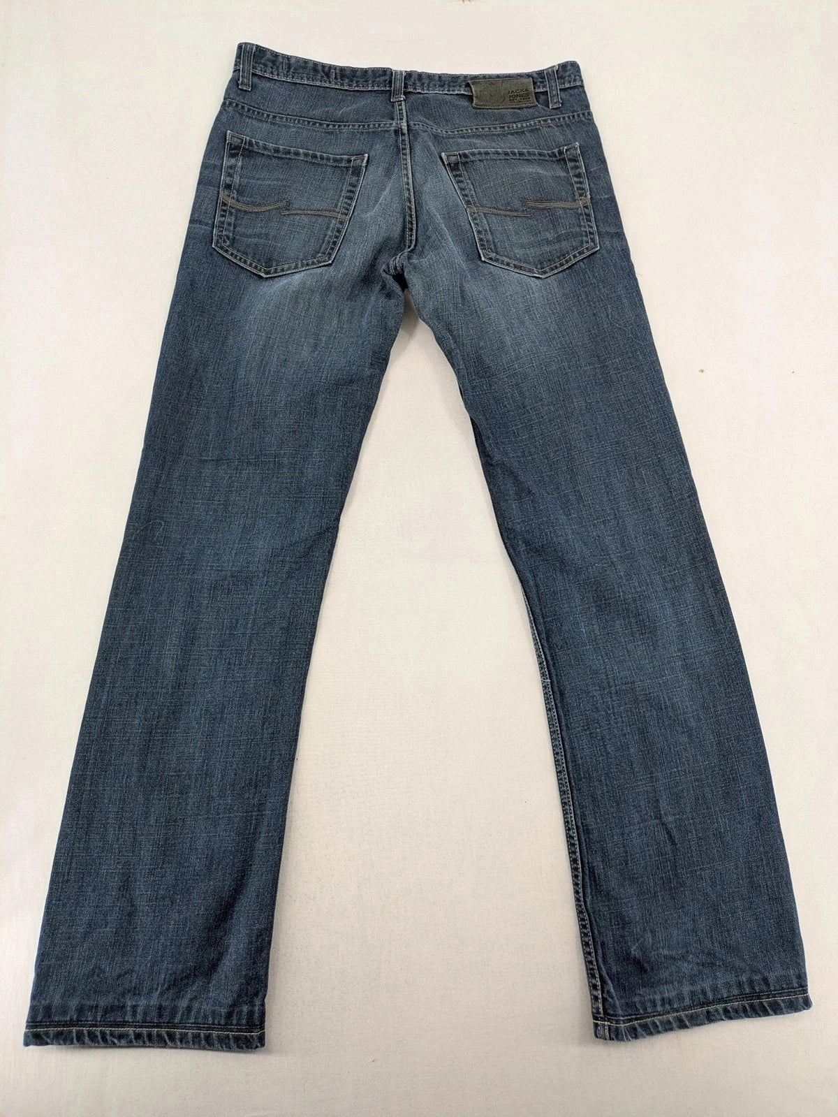 Jack & Jones blue straight jeans with button fly and classic five-pocket design.
