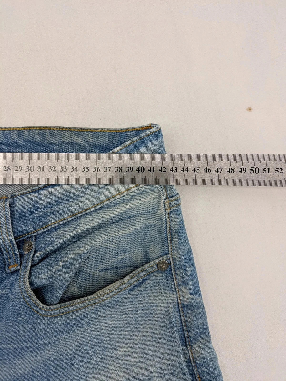 G-Star blue straight tapered jeans with classic 5-pocket design and button fly.