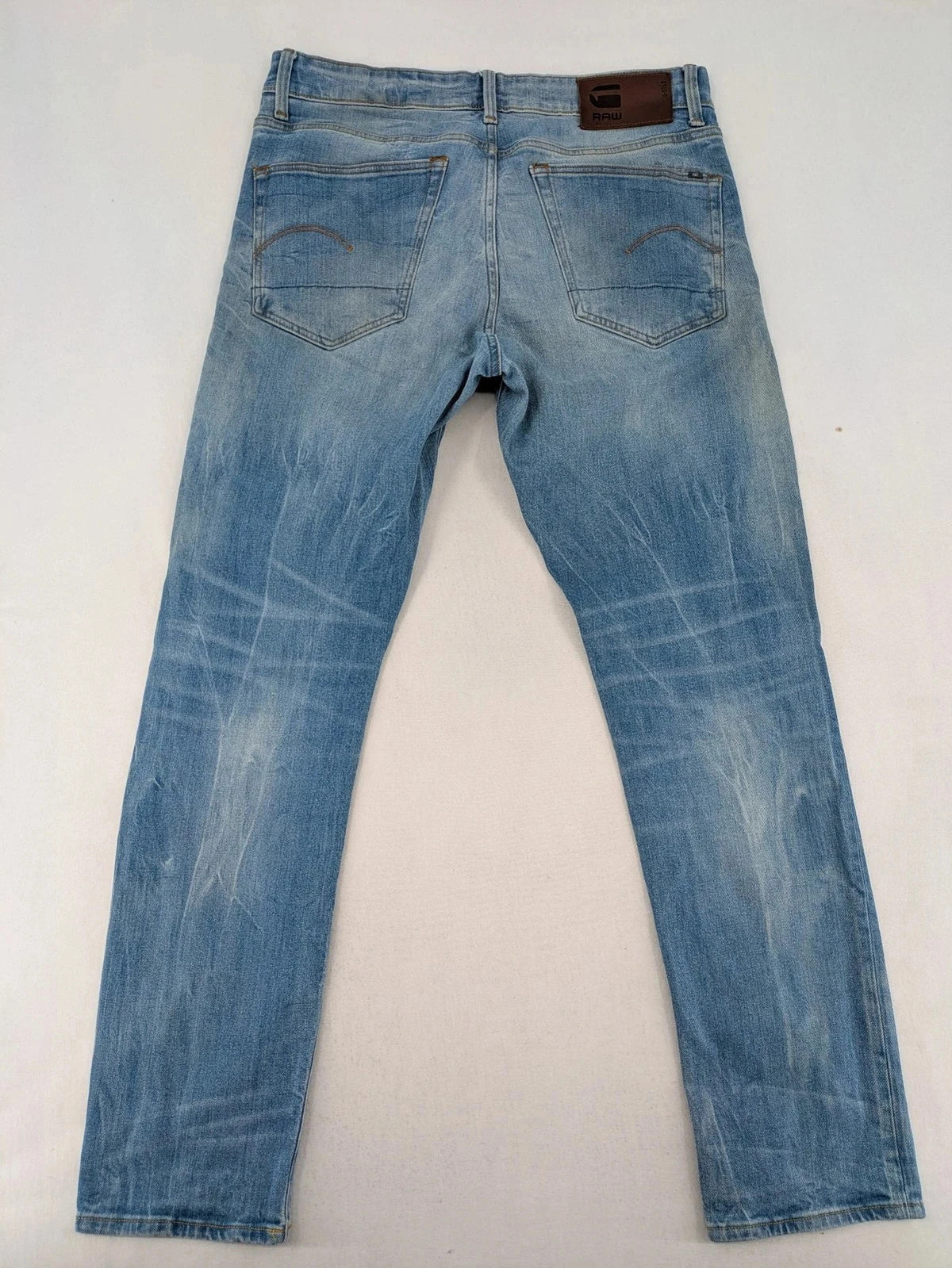 G-Star blue straight tapered jeans with classic 5-pocket design and button fly.