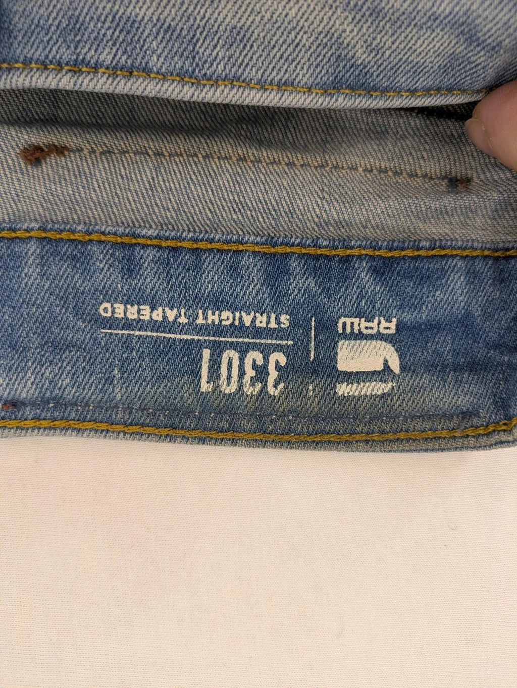 G-Star blue straight tapered jeans with classic 5-pocket design and button fly.