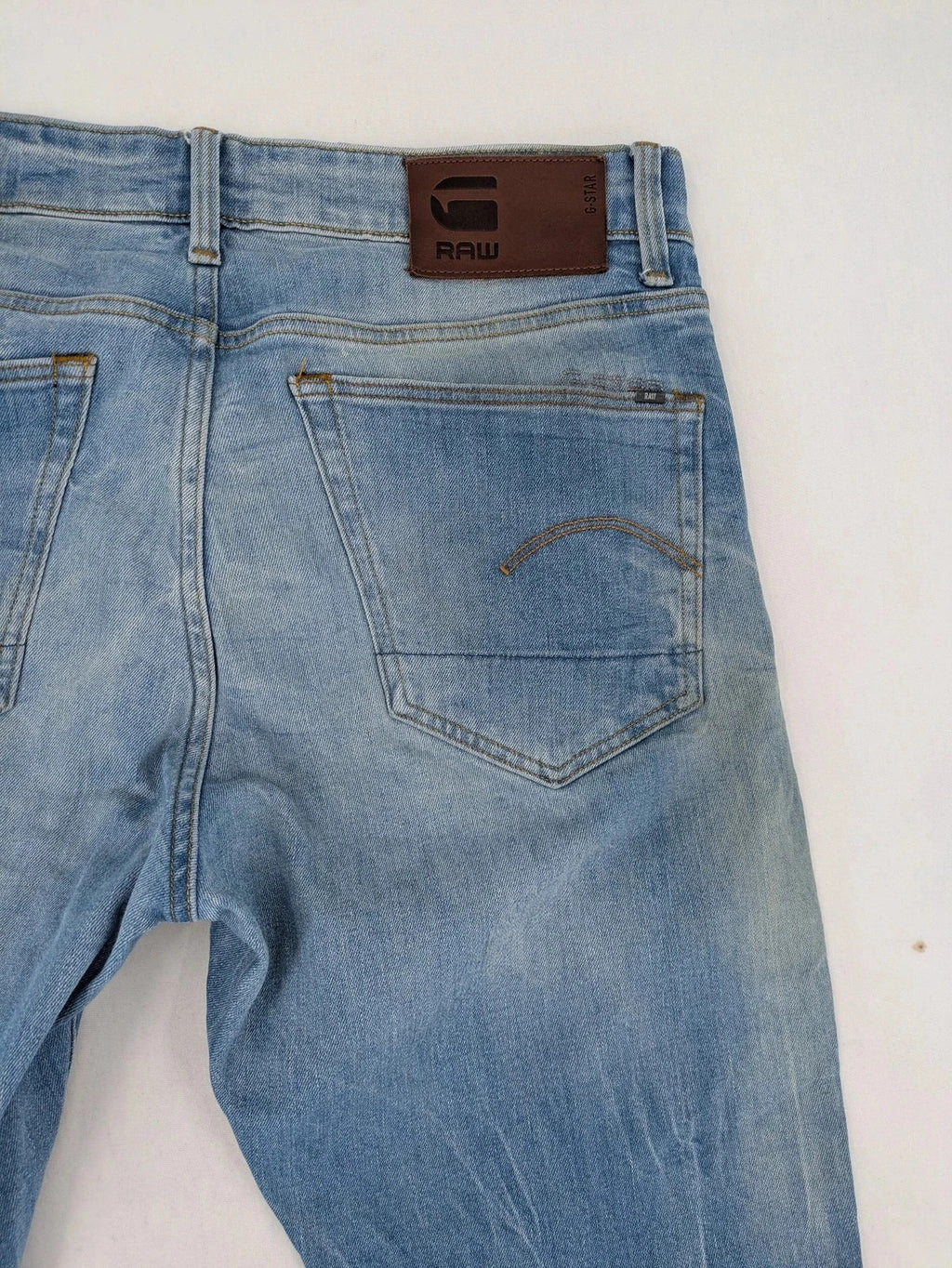 G-Star blue straight tapered jeans with classic 5-pocket design and button fly.