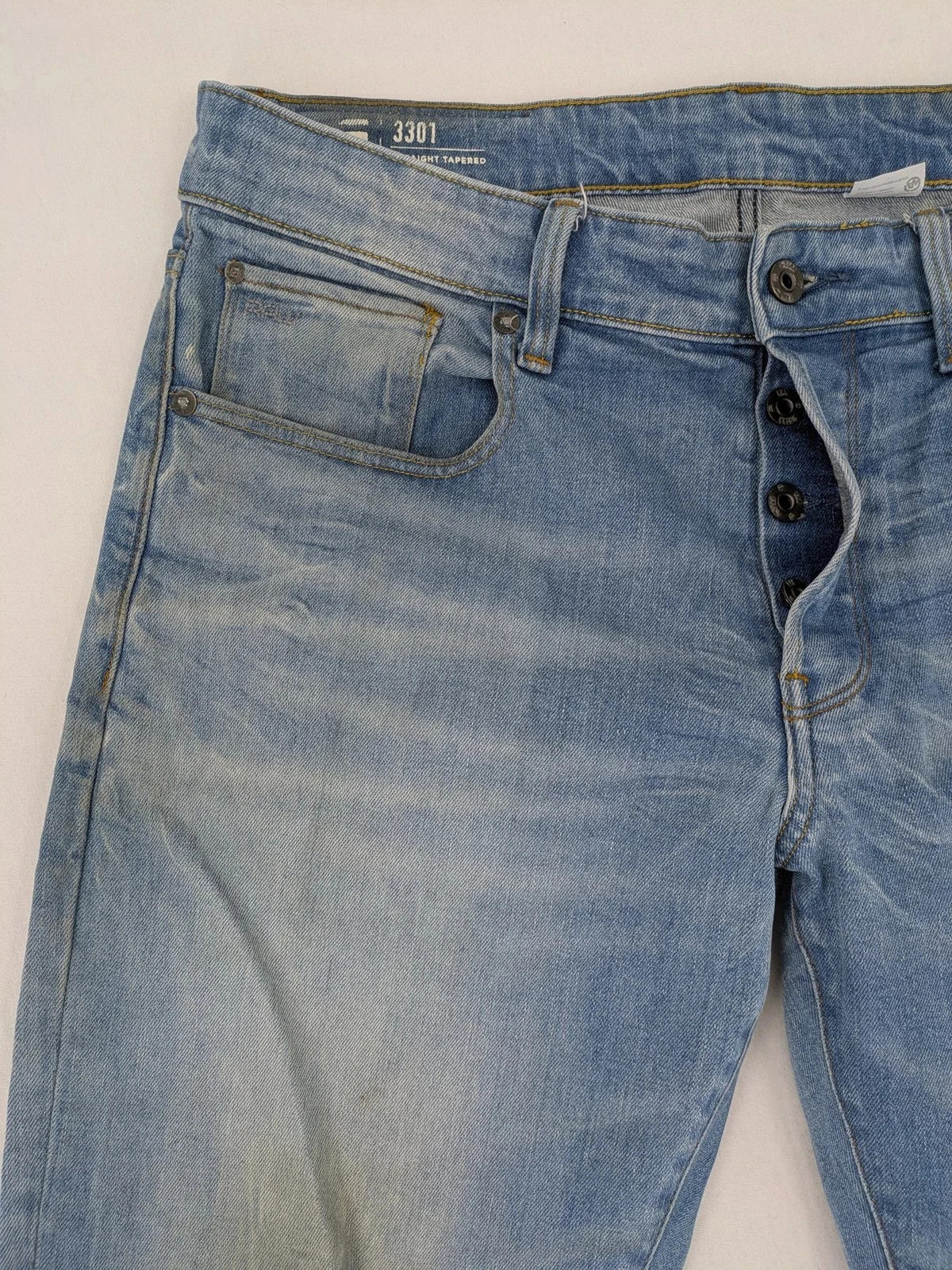 G-Star blue straight tapered jeans with classic 5-pocket design and button fly.