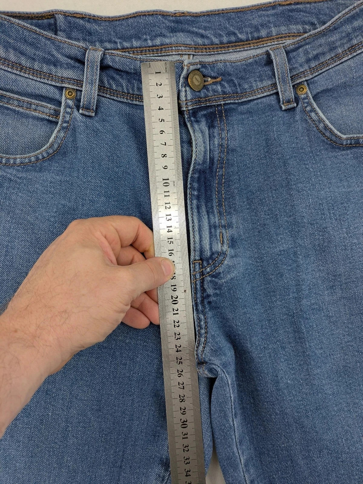 Wrangler blue straight jeans with classic wash and durable cotton-stretch blend.