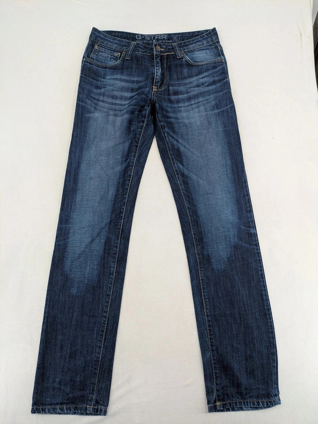 G-Star blue straight jeans with faded wash and whiskering effects, durable denim material.