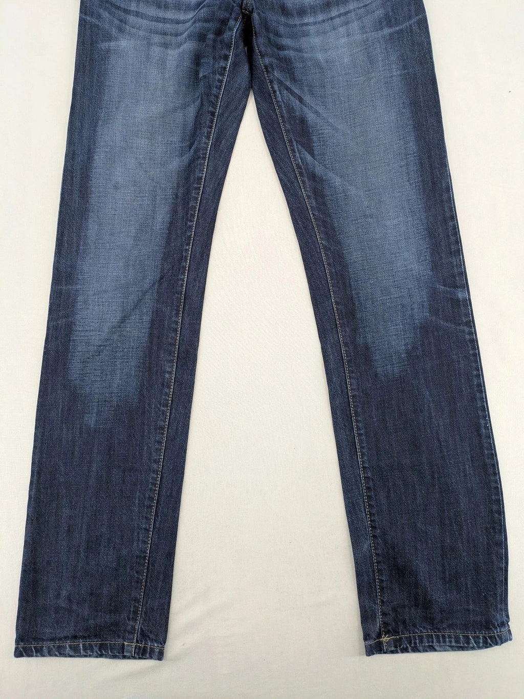 G-Star blue straight jeans with faded wash and whiskering effects, durable denim material.