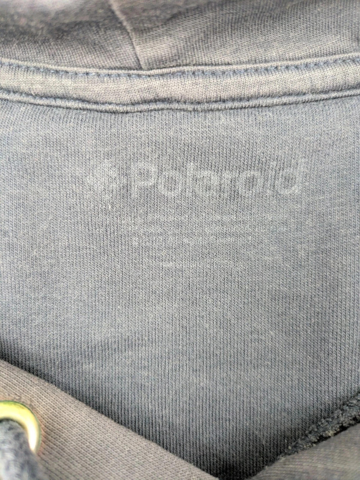 Polaroid blue graphic hoodie featuring iconic logo print with rainbow stripes and kangaroo pocket.