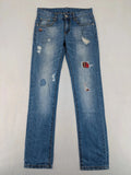 Andrew & Angel blue straight jeans distressed with red tartan patches and worn details.