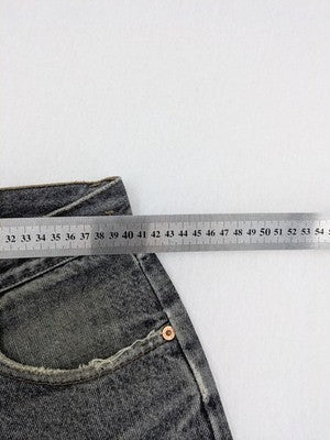 Levi's straight jeans faded black grey denim with iconic orange tab and five-pocket design.