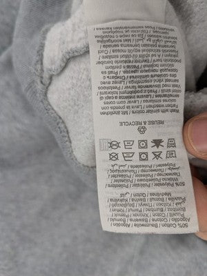 Jack & Jones grey hoodie with drawstring hood, kangaroo pocket, and ribbed cuffs.