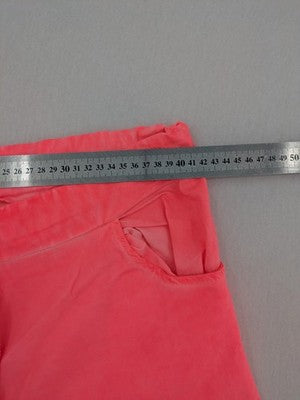 Pink Cherry pink jogpants with elastic waistband, decorative button placket, and rolled cuffs.