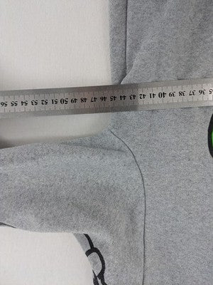 Among Us grey sweatshirt featuring colorful graphic of crew members and sleeve designs.