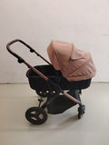 Kinderkraft pink 2-in-1 baby stroller with large wheels and elegant design.