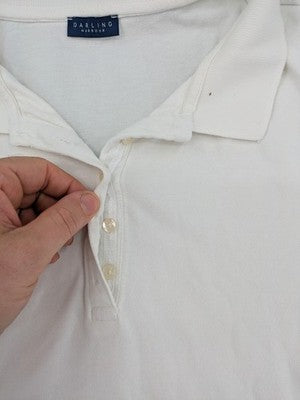 Darling Harbour white polo shirt with collar and three-button placket.