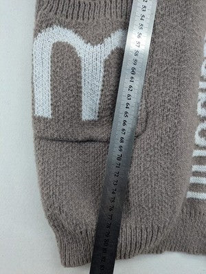 Minouu brown long cardigan with hood, featuring logo design and front pockets.