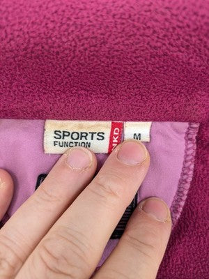 Nkd pink purple softshell jacket with fleece lining and high collar, visible wear marks.
