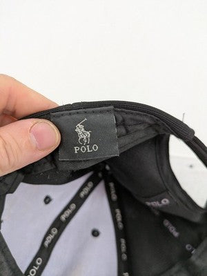 Polo black cap adjustable strapback classic design with embroidered logo and ventilation holes.