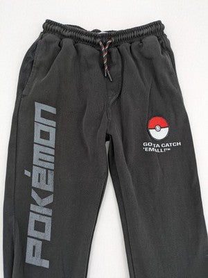 Herren grey jogging pants large Pokémon graphic print and embroidered Pokéball patch.