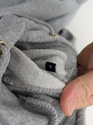 Jack & Jones grey hoodie with drawstring hood, kangaroo pocket, and ribbed cuffs.
