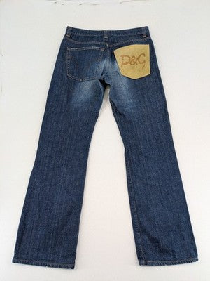Dolce & Gabbana blue bootcut jeans with suede logo patch and classic 5-pocket design.