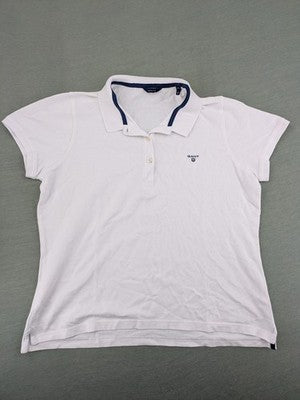 GANT white polo shirt with navy collar, embroidered logo on chest, piqué fabric.