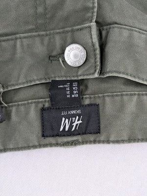 H&M khaki skinny fit jeans with classic five-pocket design and stretch cotton material.