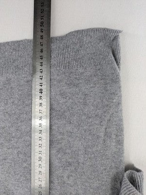 H&M grey cardigan with V-neck, button front, and layered ruffle sleeves.