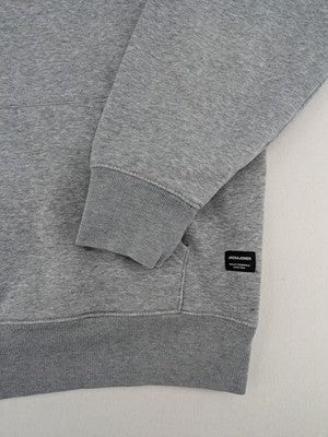 Jack & Jones grey hoodie with drawstring hood, kangaroo pocket, and ribbed cuffs.