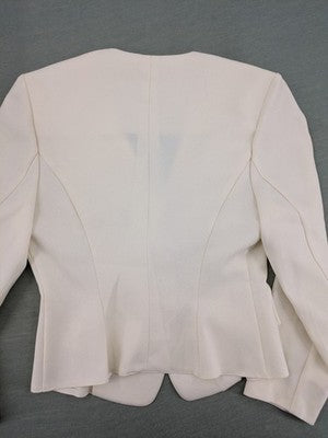 Blazer pink coat kragenlos design with V-neck and three-button front.