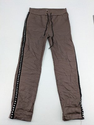 TREDY brown pants with black side stripes, silver studs, and adjustable drawstring.