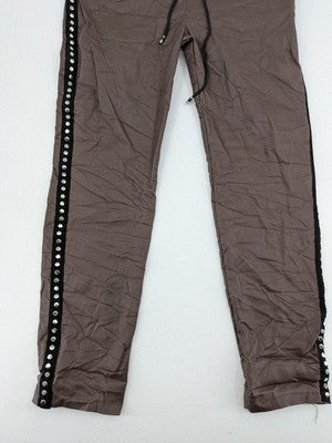 TREDY brown pants with black side stripes, silver studs, and adjustable drawstring.