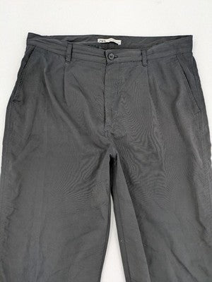 Zara grey chino pants with front pleats, rolled cuffs, and classic straight leg design.