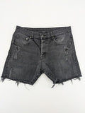 H&M black distressed skinny jeans shorts with frayed hem and button fly detail.