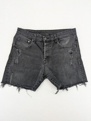 H&M black distressed skinny jeans shorts with frayed hem and button fly detail.