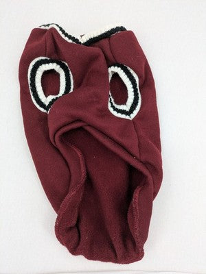 Burgundy dog sweater fleece lined with black and white striped trim, embroidered patch detail.