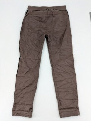 TREDY brown pants with black side stripes, silver studs, and adjustable drawstring.