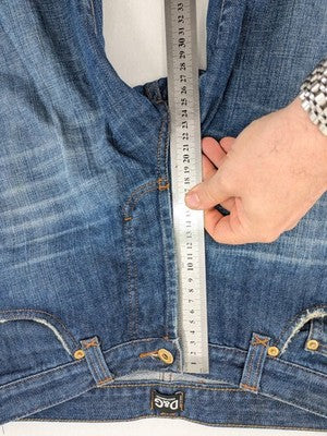 Dolce & Gabbana blue bootcut jeans with suede logo patch and classic 5-pocket design.